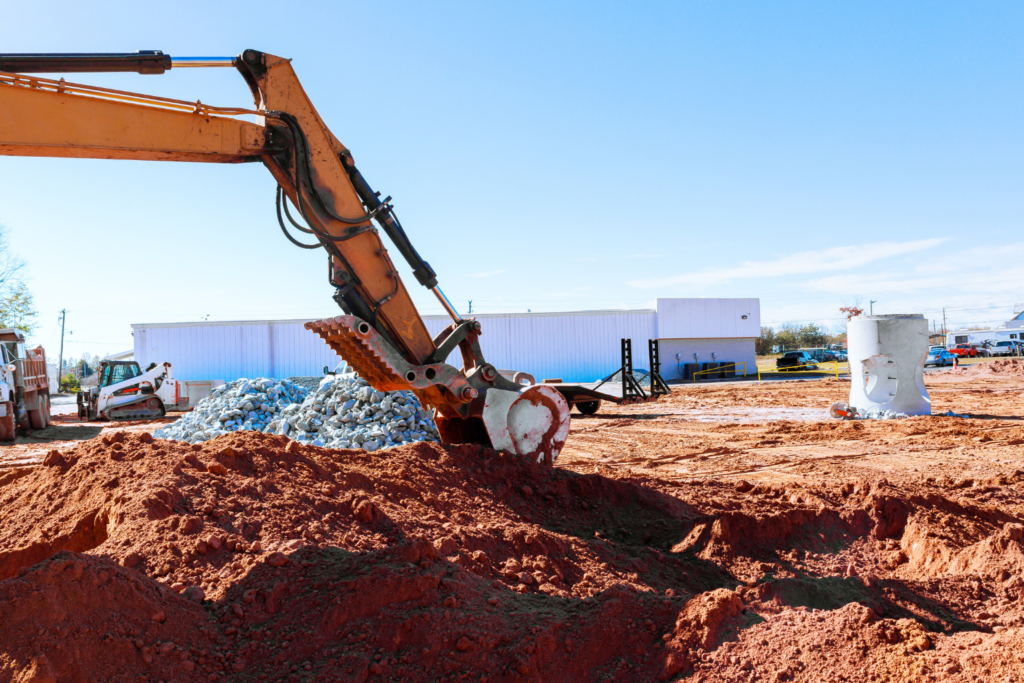 Excavator bucket scooping dirt