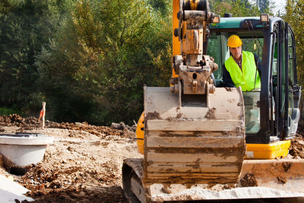 Close-up of an excavator with a driver