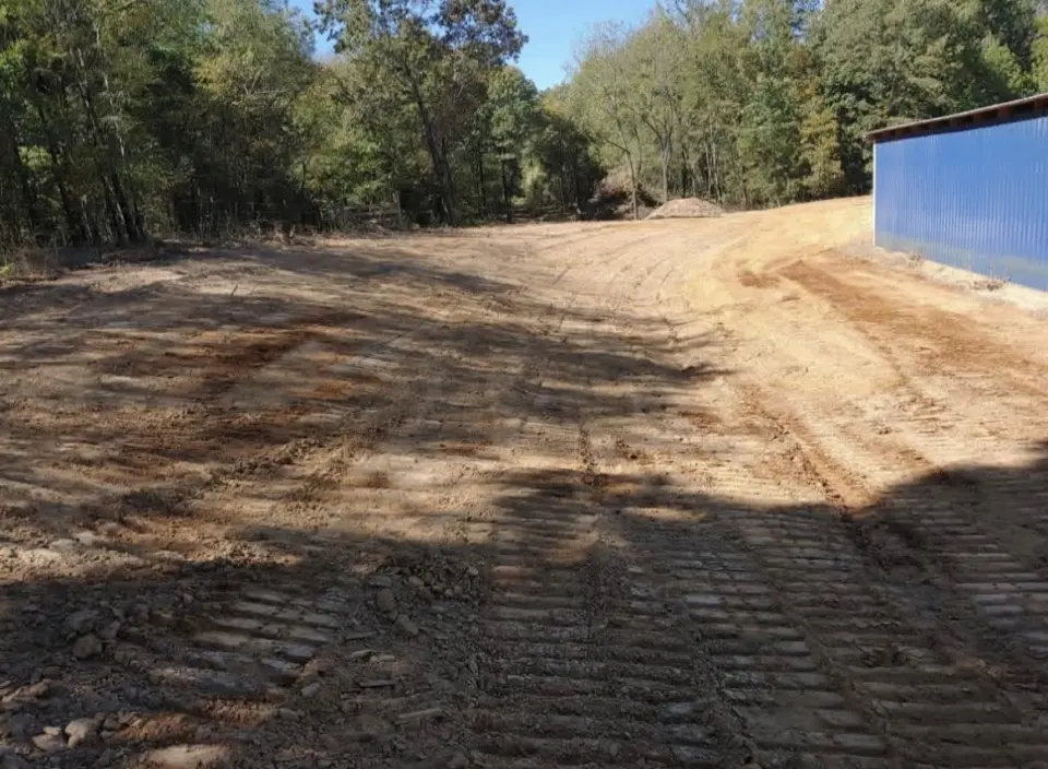 Grading beside an existing building