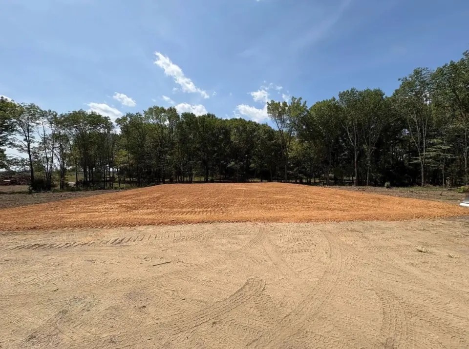 Building-pad construction and precision grading