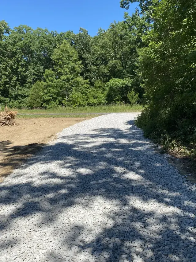 Gravel driveway entrance and property access