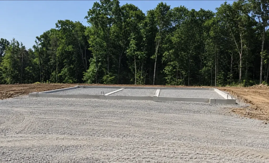 Prepared site and gravel base around a foundation
