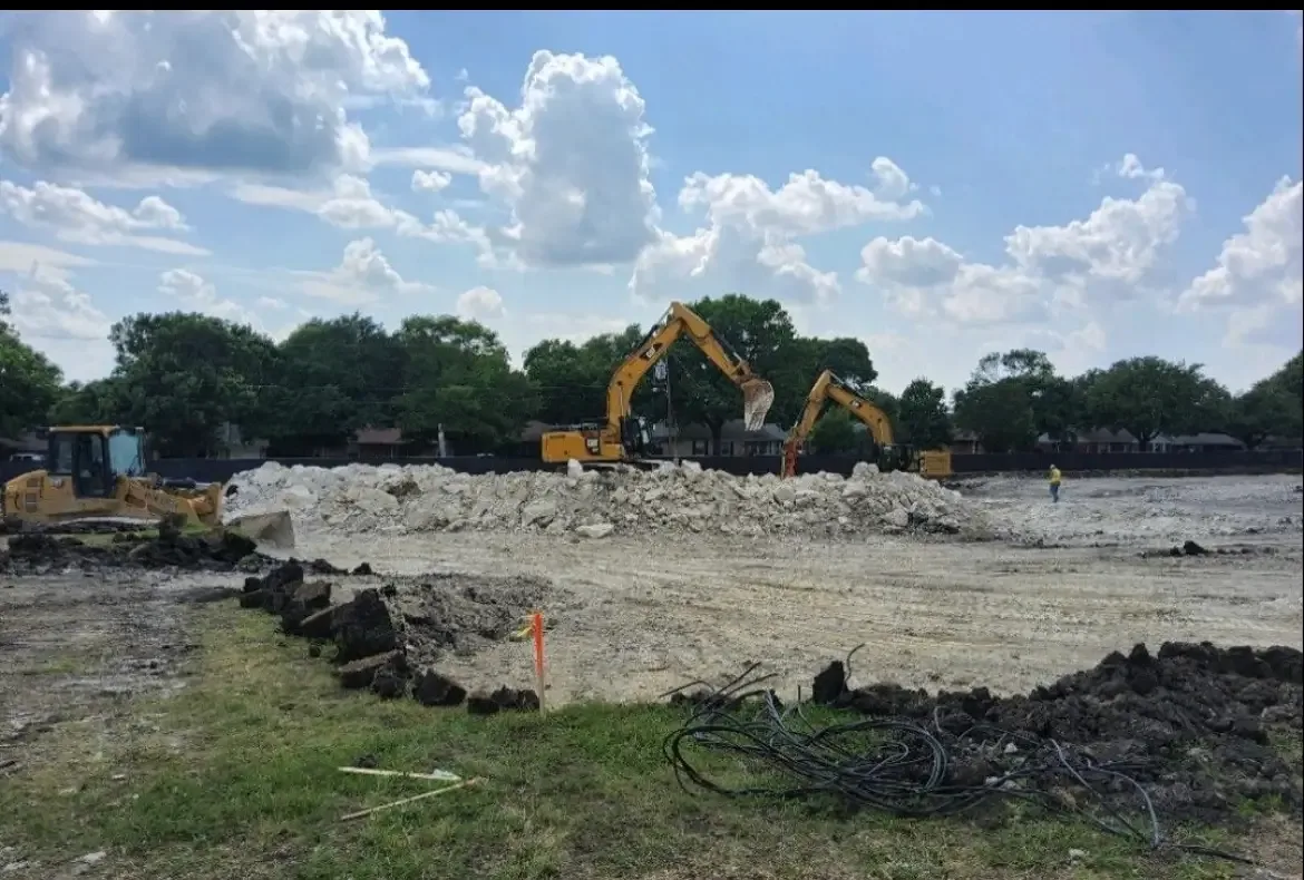 Excavators working across a demolition site